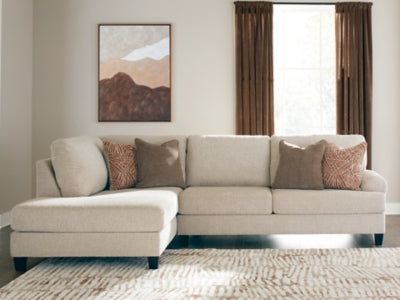 Ashley Furniture Steelwater Retreat sectional with chaise, featuring plush cushions and modern design in a cozy living room setting.
