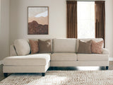Ashley Furniture Steelwater Retreat sectional with chaise, featuring plush cushions and modern design in a cozy living room setting.