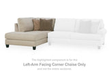 Ashley Furniture Steelwater Retreat sectional with chaise, featuring plush cushions and modern design in a cozy living room setting.