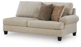 Ashley Furniture Steelwater Retreat sectional with chaise, featuring plush cushions and modern design, shown from an angled side view.