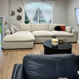 Right-facing Ashley Furniture Atlas Cloud sectional with chaise, three-piece living room sofa in neutral fabric.