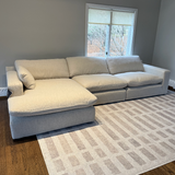 Ashley Furniture Atlas Cloud sectional with right-facing chaise, three-piece sofa set showcasing plush upholstery and modern design.