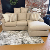 Ashley Furniture Lennox sectional sofa with chaise, showing plush fabric upholstery and modern design in a living room setting.