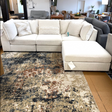 Ashley Furniture Pebblebrook 3-piece sectional sofa with ottoman, featuring plush fabric and modern design.