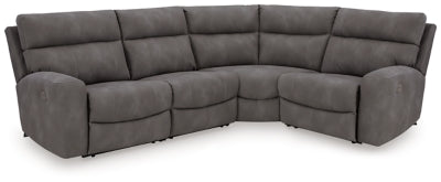 Ashley Furniture Next-Gen DuraPella power reclining sectional with plush cushions and modern design, shown in a spacious living room.