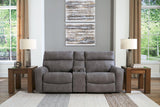 Ashley Furniture Next-Gen DuraPella power reclining sectional loveseat with built-in console, showing plush cushions and modern design.