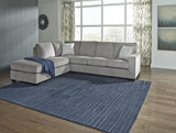 Ashley Furniture Altari sectional with chaise showing plush fabric upholstery and modern design, perfect for contemporary living rooms.