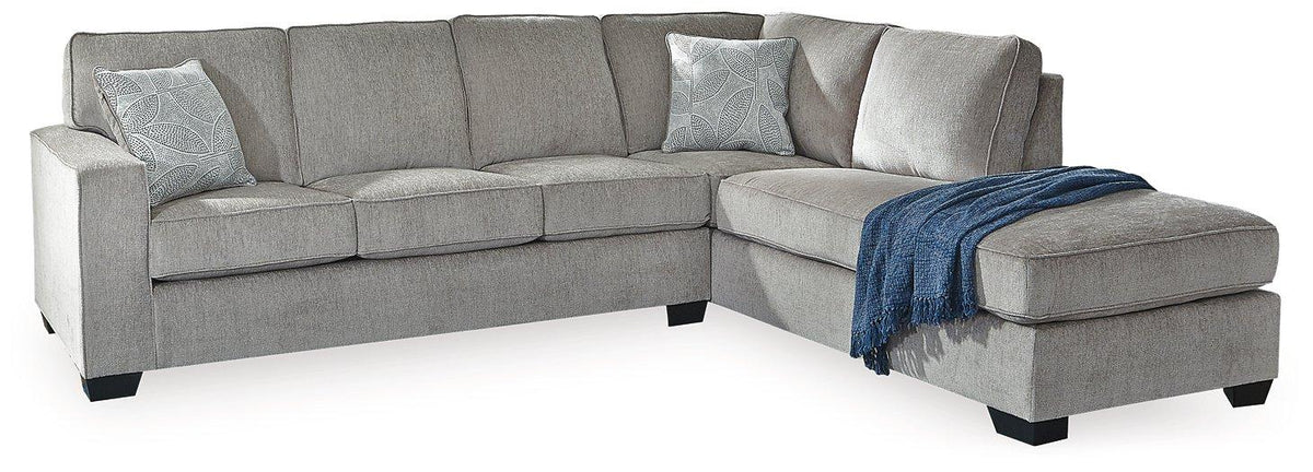 Ashley Furniture Altari sectional with chaise, showcasing plush upholstery and modern design in a spacious living room setting.