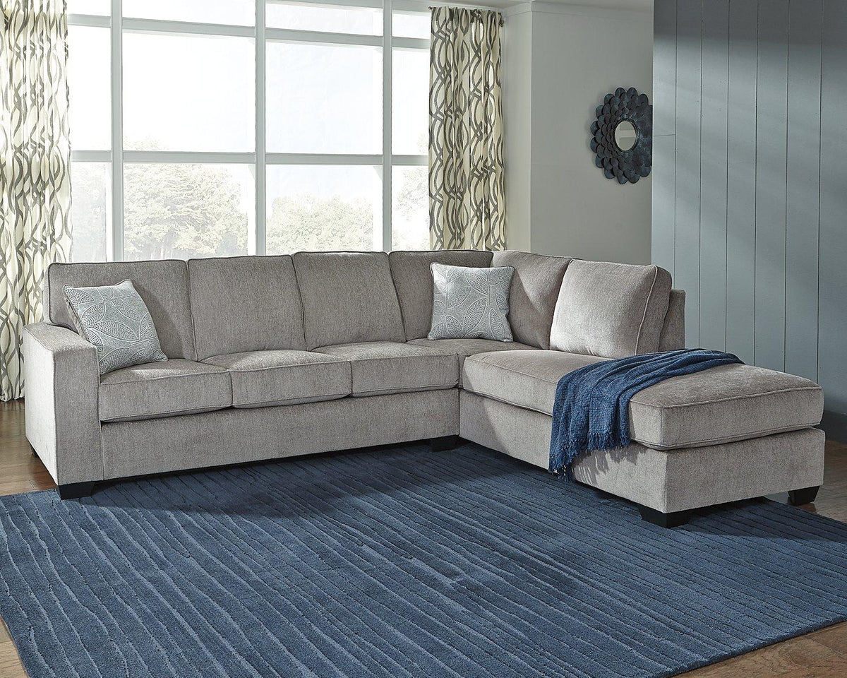 Ashley Furniture Altari sectional with chaise, featuring plush fabric, modern design, and spacious seating in a stylish living room setting.