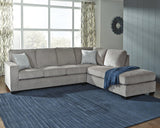 Ashley Furniture Altari sectional with chaise, featuring plush fabric, modern design, and spacious seating in a stylish living room setting.