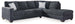 Ashley Furniture Altari sleeper sectional with chaise, featuring plush fabric, modern design, and spacious seating for living room comfort.