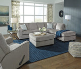 Ashley Furniture Altari sleeper sectional with chaise, showcasing plush fabric upholstery and a spacious lounge area.