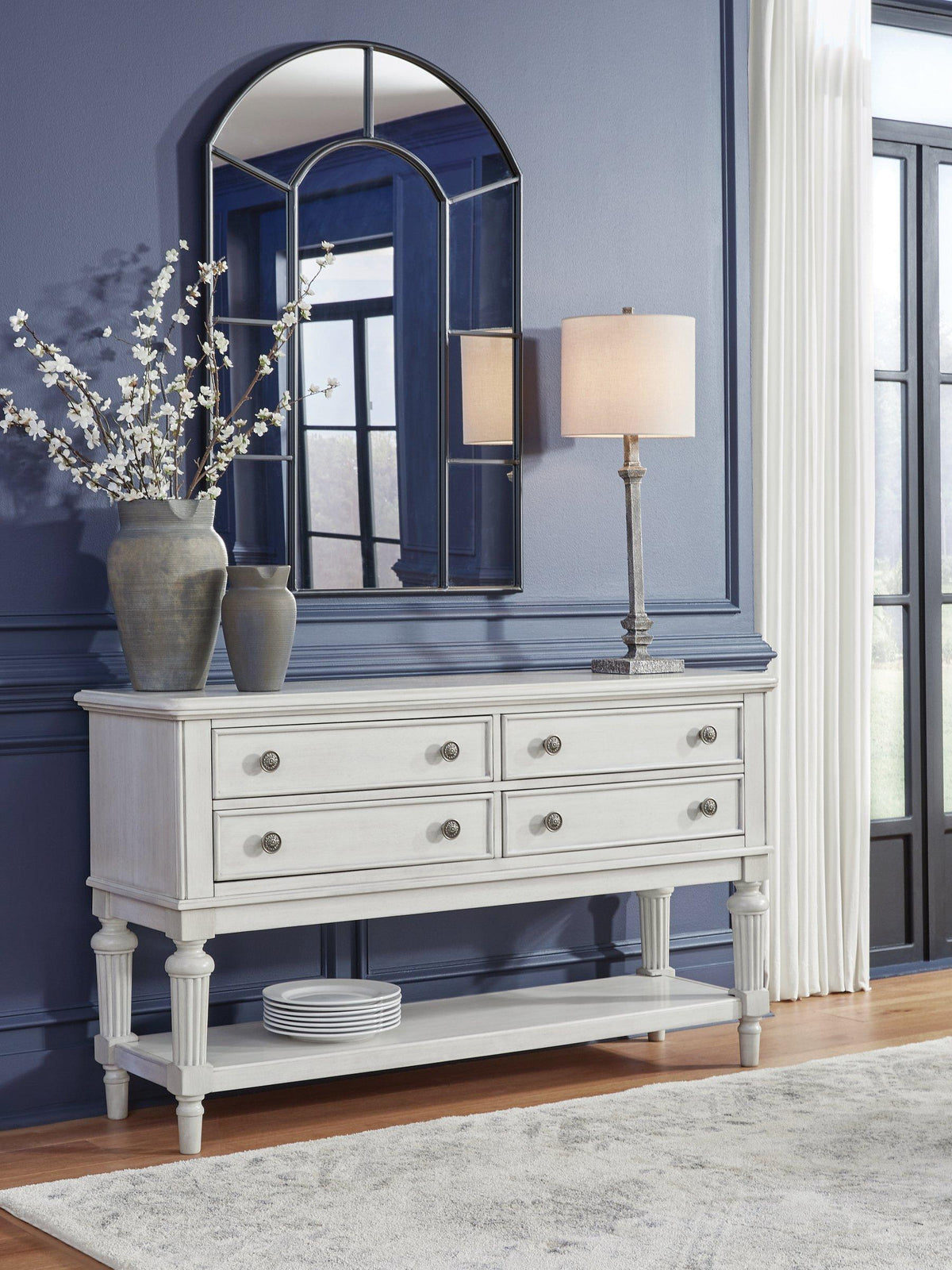 Ashley Furniture Montelaine dining server with wooden finish, featuring multiple drawers and cabinet storage for elegant dining room organization.