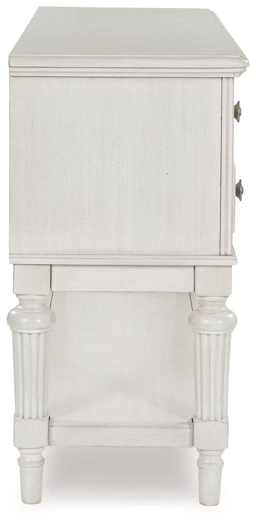 Montelaine dining server by Ashley Furniture featuring a wooden finish and multiple storage compartments for serving and storage.