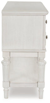Montelaine dining server by Ashley Furniture featuring a wooden finish and multiple storage compartments for serving and storage.