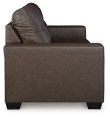 Ashley Furniture Barlin Mills sofa sleeper with beige fabric, showing the side view with rolled arms and wooden legs.