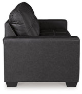 Ashley Furniture Barlin Mills sofa sleeper with plush upholstery and fold-out bed, stylish and comfortable for guest accommodations.