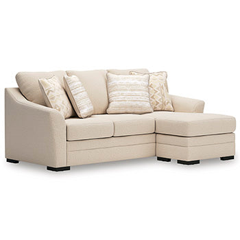 Ashley Furniture Lango Sofa Chaise Sleeper with angled view, plush fabric and convertible sleeper feature in a modern design.
