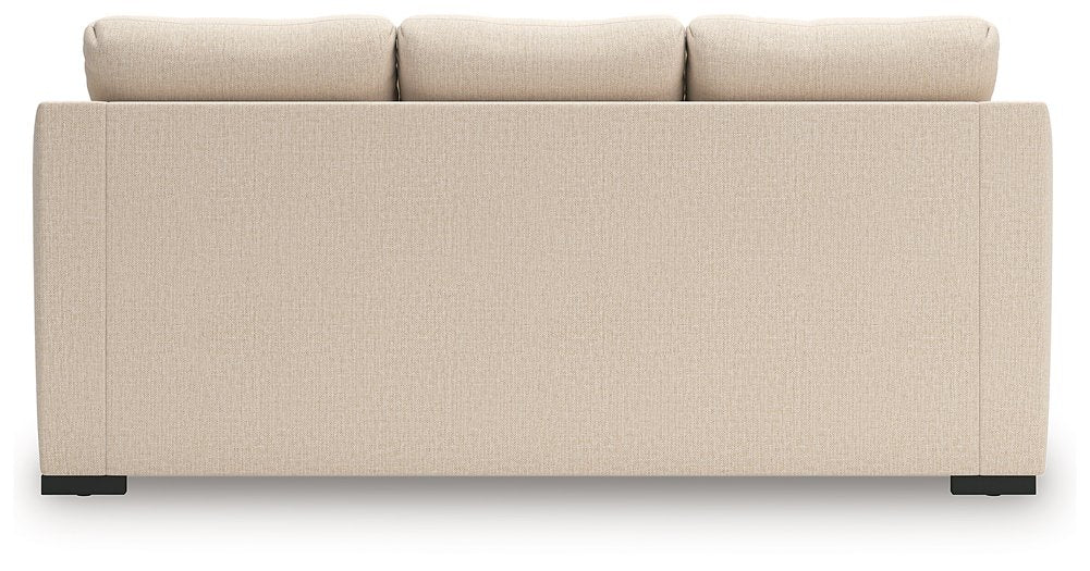 Ashley Furniture Lango sofa with chaise sleeper, featuring plush cushions and a contemporary design in neutral fabric.