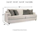 Ashley Furniture Soletren Sofa Sleeper, beige fabric sleeper sofa with plush cushions and pull-out bed, in a modern living room setting.
