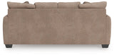 Ashley Furniture Triston-Peaks sleeper sofa with plush fabric, showing the back view and comfortable seating in a modern living room setting.