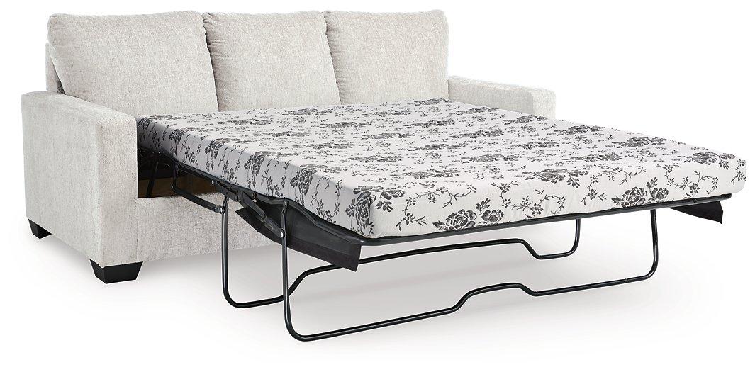 Ashley Furniture Rannis sleeper sofa, shown in a modern living room setting with plush cushions and a sleek design.