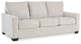 Ashley Furniture Rannis sleeper sofa with beige upholstery and plush cushions, ideal for seating and sleeping.