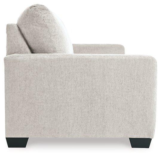 Ashley Furniture Rannis sofa sleeper with plush fabric and fold-out bed, showcasing its modern design and comfortable seating.