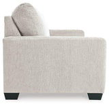 Ashley Furniture Rannis sofa sleeper with plush fabric and fold-out bed, showcasing its modern design and comfortable seating.