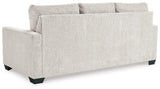 Ashley Furniture Rannis sofa sleeper with plush fabric, featuring a stylish design and fold-out bed for versatile seating and sleeping space.