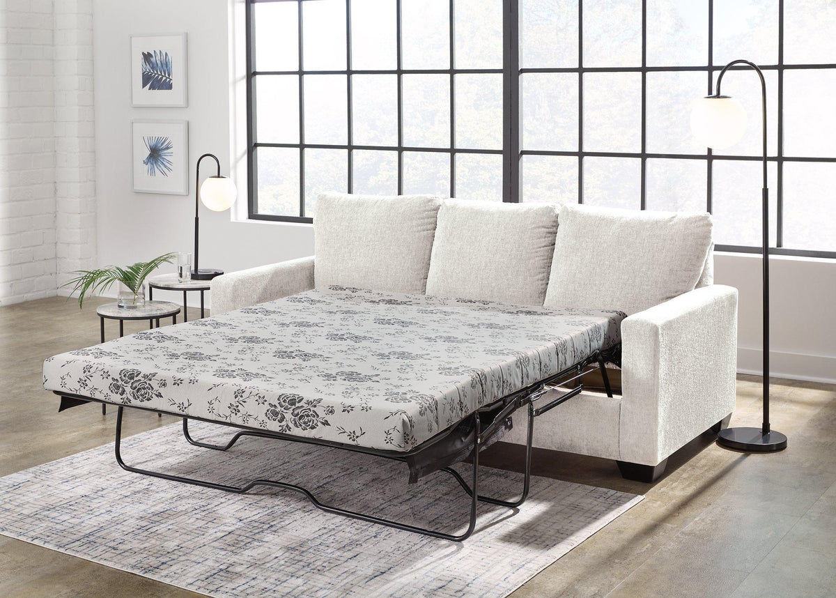 Ashley Furniture Rannis sofa sleeper with plush fabric and convertible design, shown in a modern living room setting.