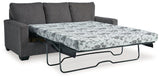 Ashley Furniture Rannis Sofa Sleeper with plush fabric and convertible design, showcasing its modern style and comfortable seating.