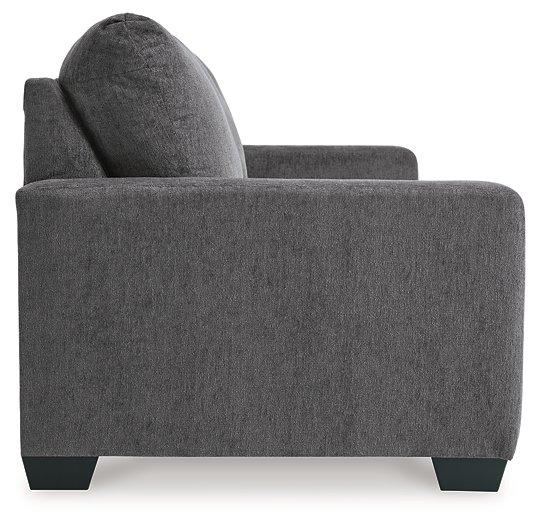 Ashley Furniture Rannis sofa sleeper with plush fabric, shown in a modern living room setting, featuring a comfortable sleeping surface.