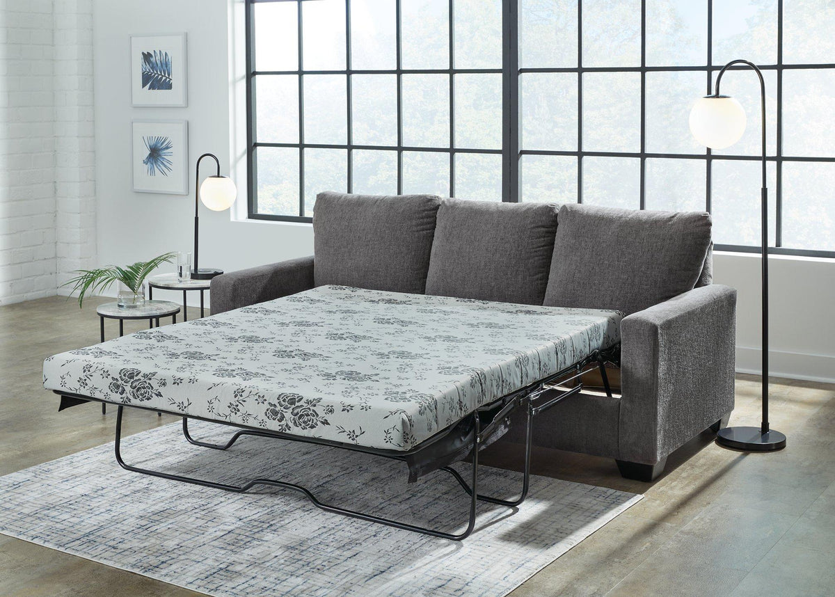 Ashley Furniture Rannis sofa sleeper with plush fabric and convertible design, perfect for versatile seating and sleeping comfort.