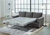 Ashley Furniture Rannis sofa sleeper with plush fabric and convertible design, perfect for versatile seating and sleeping comfort.