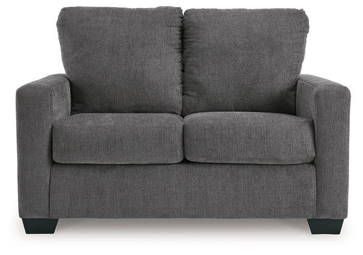 Ashley Furniture Rannis Sofa Sleeper with plush fabric and modern design, showcasing its convertible sleeper feature.