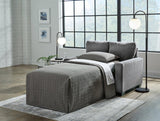 Ashley Furniture Rannis sofa sleeper with plush fabric, featuring a modern design and fold-out bed for versatile living space.