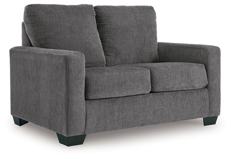 Ashley Furniture Rannis sofa sleeper with plush fabric and modern design, shown as a versatile living room piece.