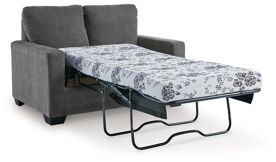 Ashley Furniture Rannis sofa sleeper with plush fabric and fold-out bed, stylish living room furniture.