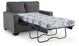 Ashley Furniture Rannis sofa sleeper with plush fabric and fold-out bed, stylish living room furniture.