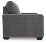 Ashley Furniture Rannis sleeper sofa, stylish beige fabric with plush cushions and a fold-out bed for versatile comfort and seating.