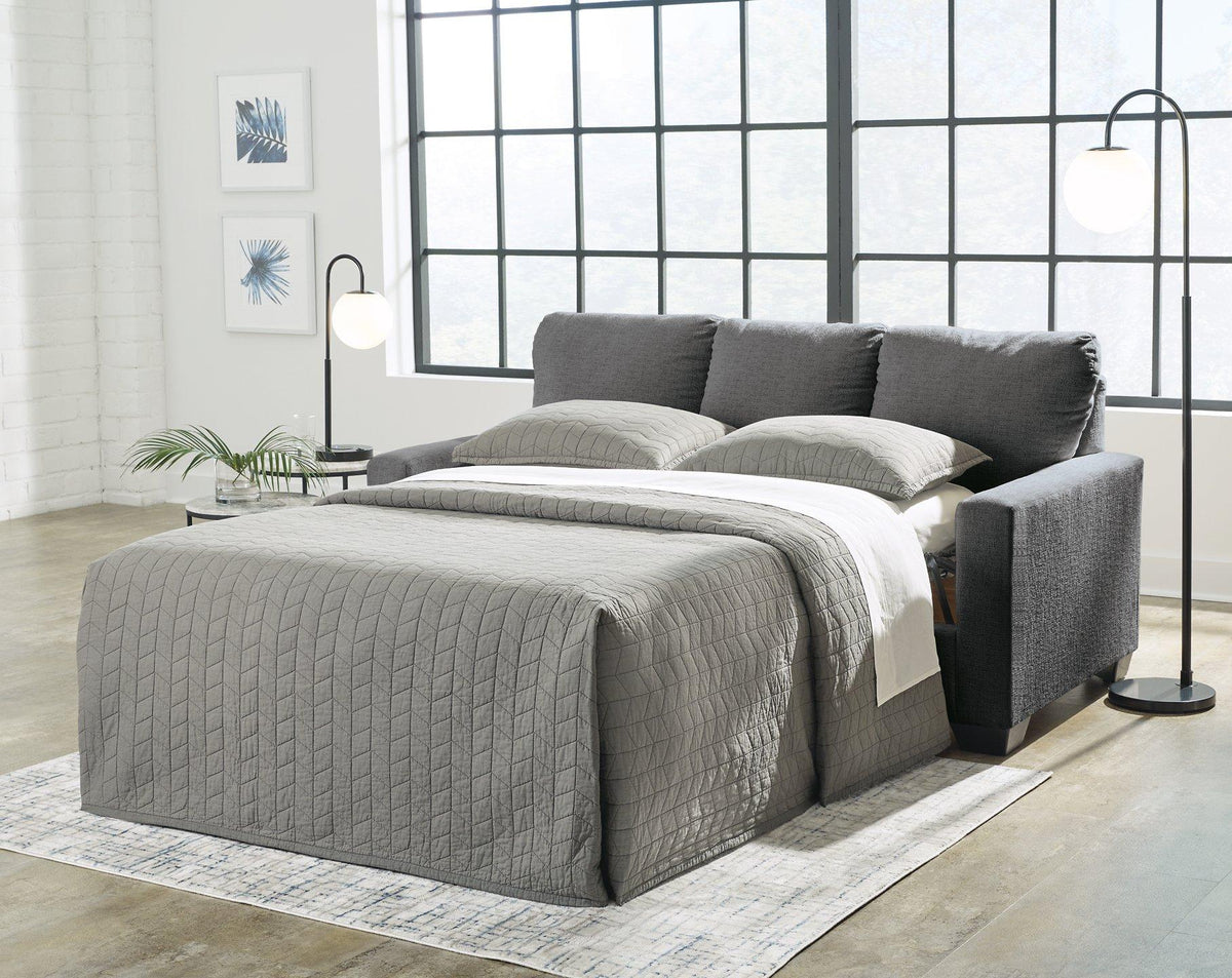 Ashley Furniture Rannis sofa sleeper with plush fabric and convertible design, ideal for comfortable seating and sleeping space.