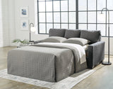 Ashley Furniture Rannis sofa sleeper with plush fabric and convertible design, ideal for comfortable seating and sleeping space.
