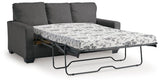 Ashley Furniture Rannis sofa sleeper with plush cushions and a modern design, shown as a versatile living room piece