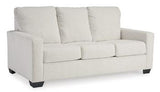 Ashley Furniture Rannis sofa sleeper with plush fabric, featuring a fold-out bed and modern design for versatile living space.