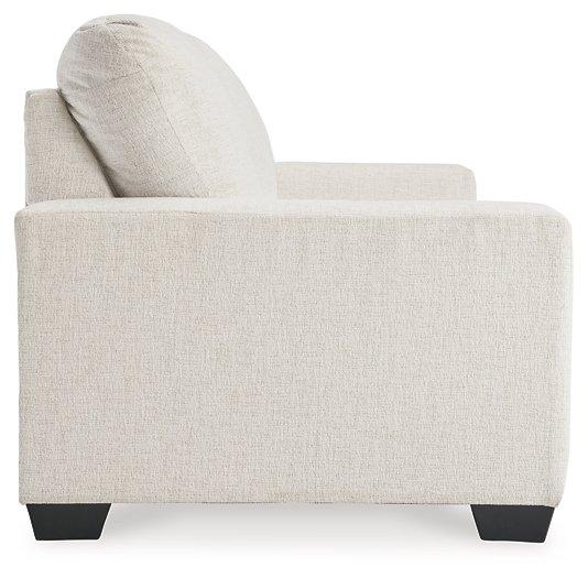 Ashley Furniture Rannis sofa sleeper with plush fabric and convertible design, ideal for relaxing or overnight guests.