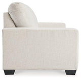 Ashley Furniture Rannis sofa sleeper with plush fabric and convertible design, ideal for relaxing or overnight guests.