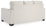 Ashley Furniture Rannis sleeper sofa with plush upholstery and fold-out bed, ideal for versatile living room seating and sleeping space.