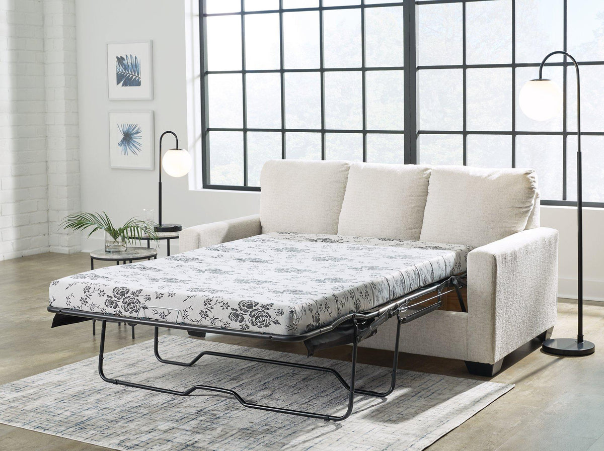 Ashley Furniture Rannis sofa sleeper with plush fabric, showing the convertible sleeper and modern design in a cozy living room setting.