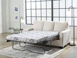Ashley Furniture Rannis sofa sleeper with plush fabric, showing the convertible sleeper and modern design in a cozy living room setting.